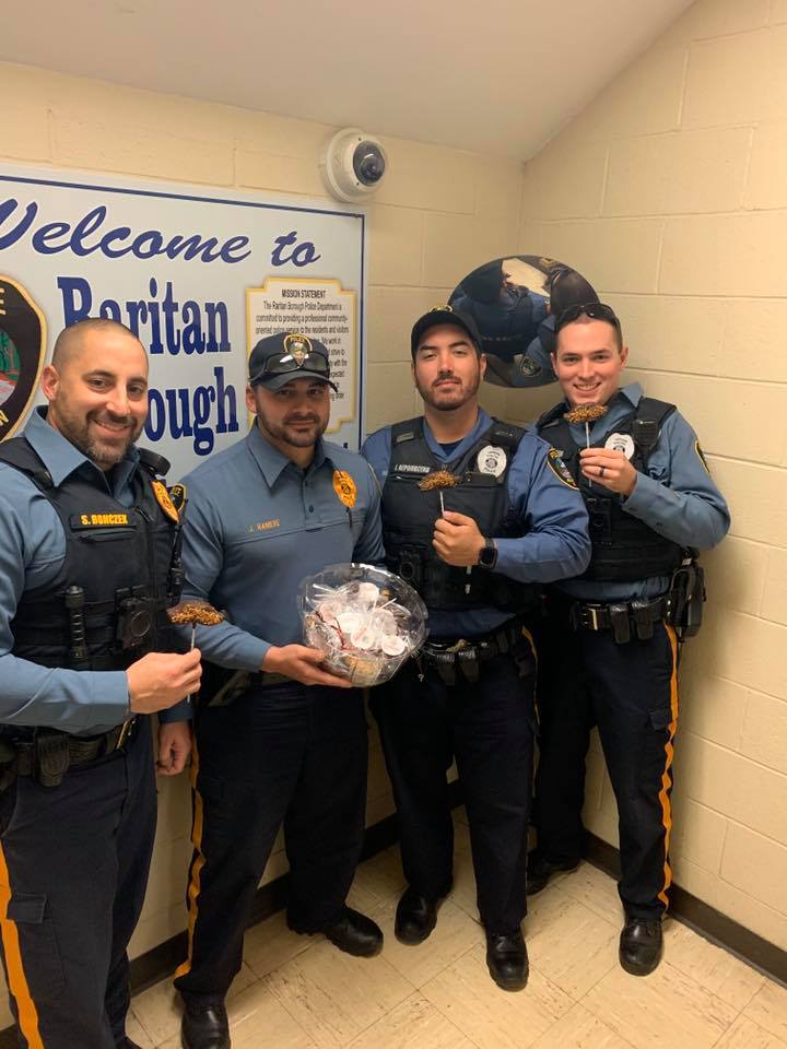 Officers posing with candy mustaches for No Shave November